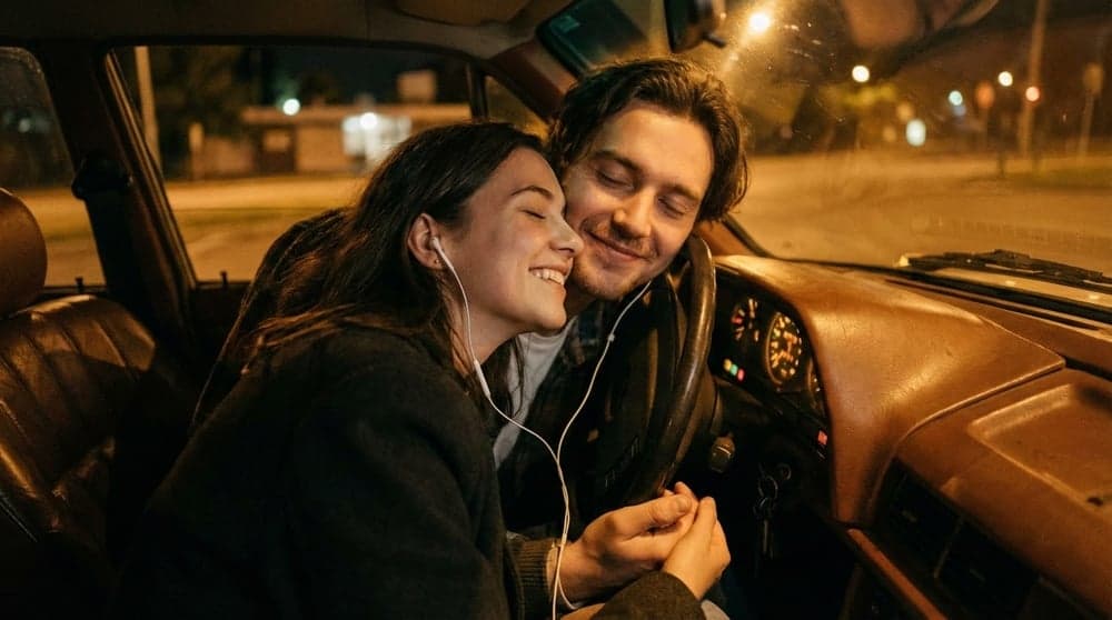 Couple sharing an emotional moment with music